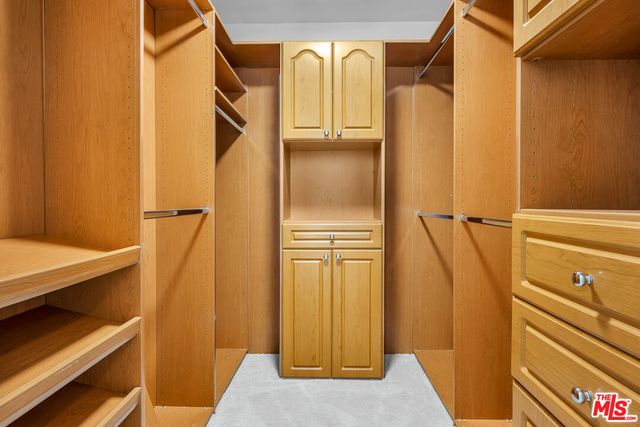 a bathroom with a sink toilet and mirror
