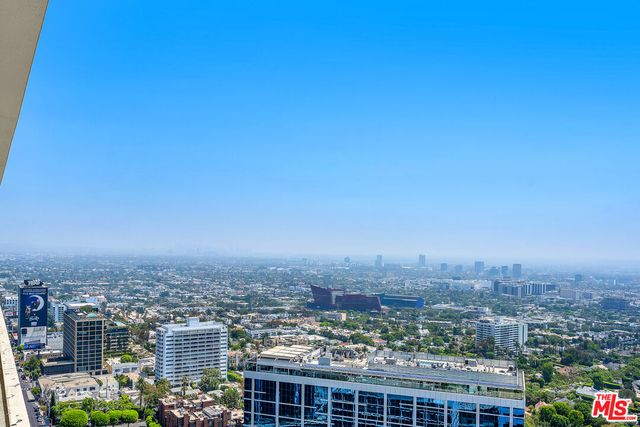a view of a swimming pool with outdoor seating