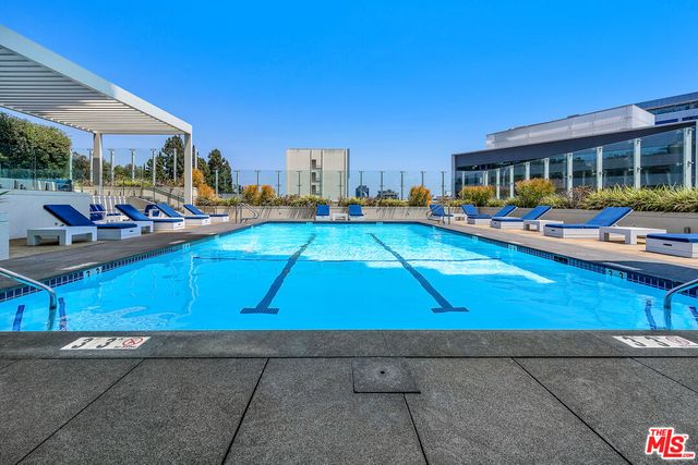 a view of a swimming pool with a patio