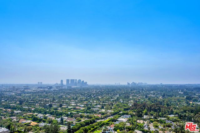 a view of a hallway with a kitchen