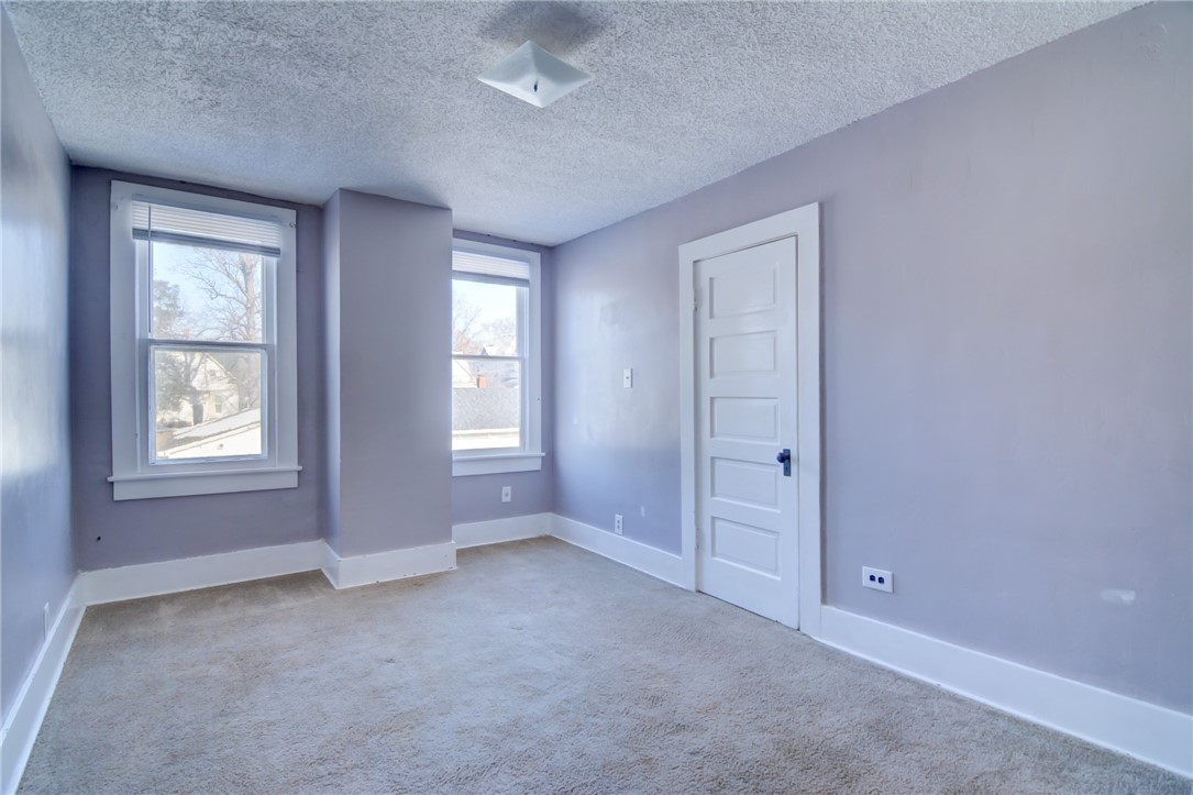 1460 West Decatur Street Decatur, IL 62522 - Photo 13 of 22 an empty room with windows and closet