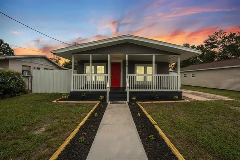 a view of house with backyard