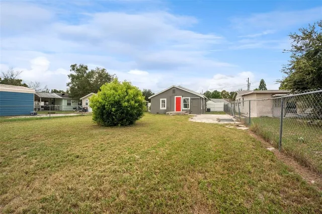 a backyard of a house with lots of green space