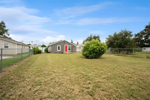 a house view with swimming pool in front of it