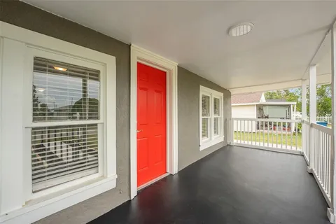 a view of a room with a large window