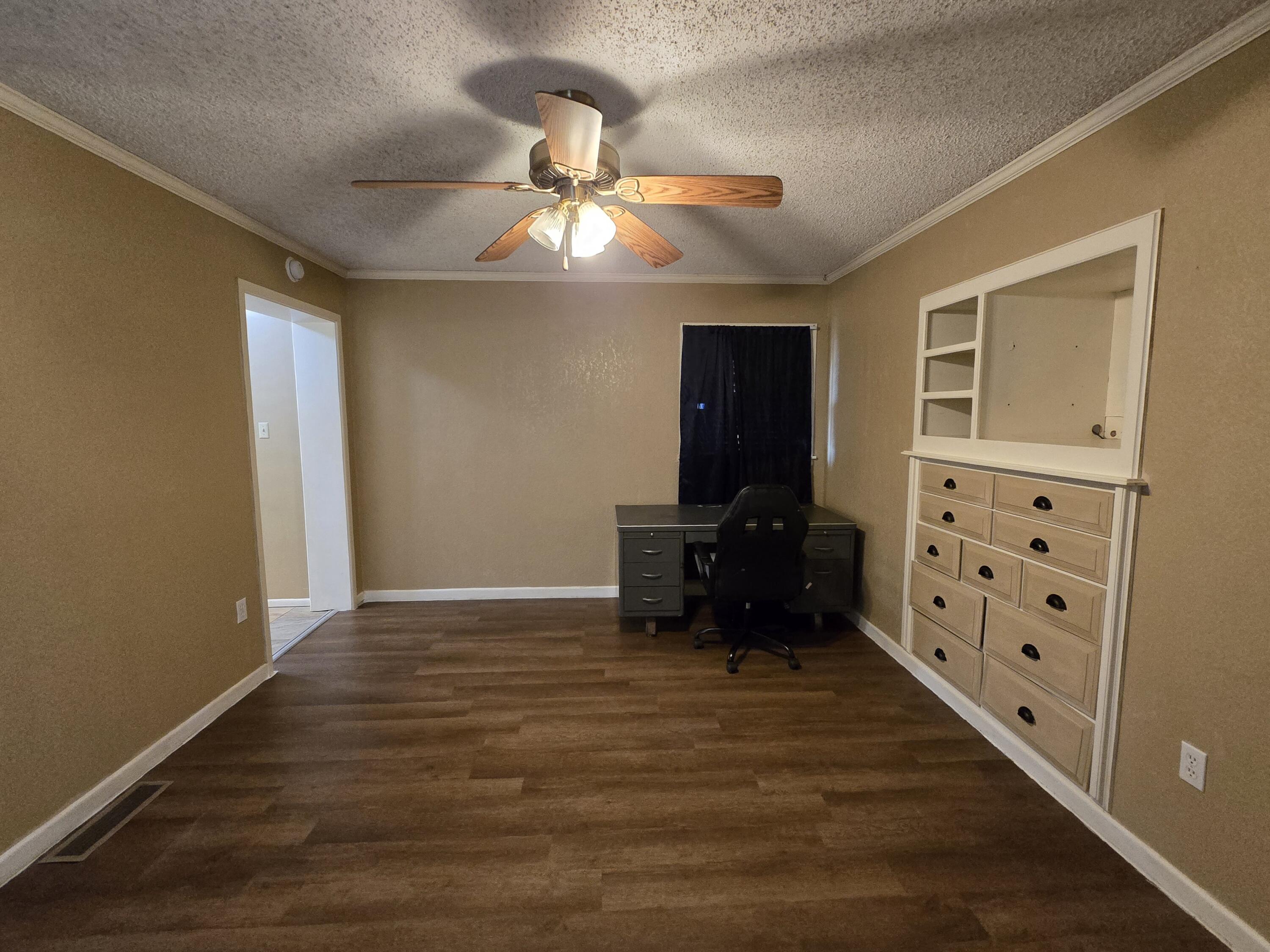 506 North 19th Street Lamesa, TX 79331 - Photo 13 of 29 a view of workspace with furniture cabinet and window