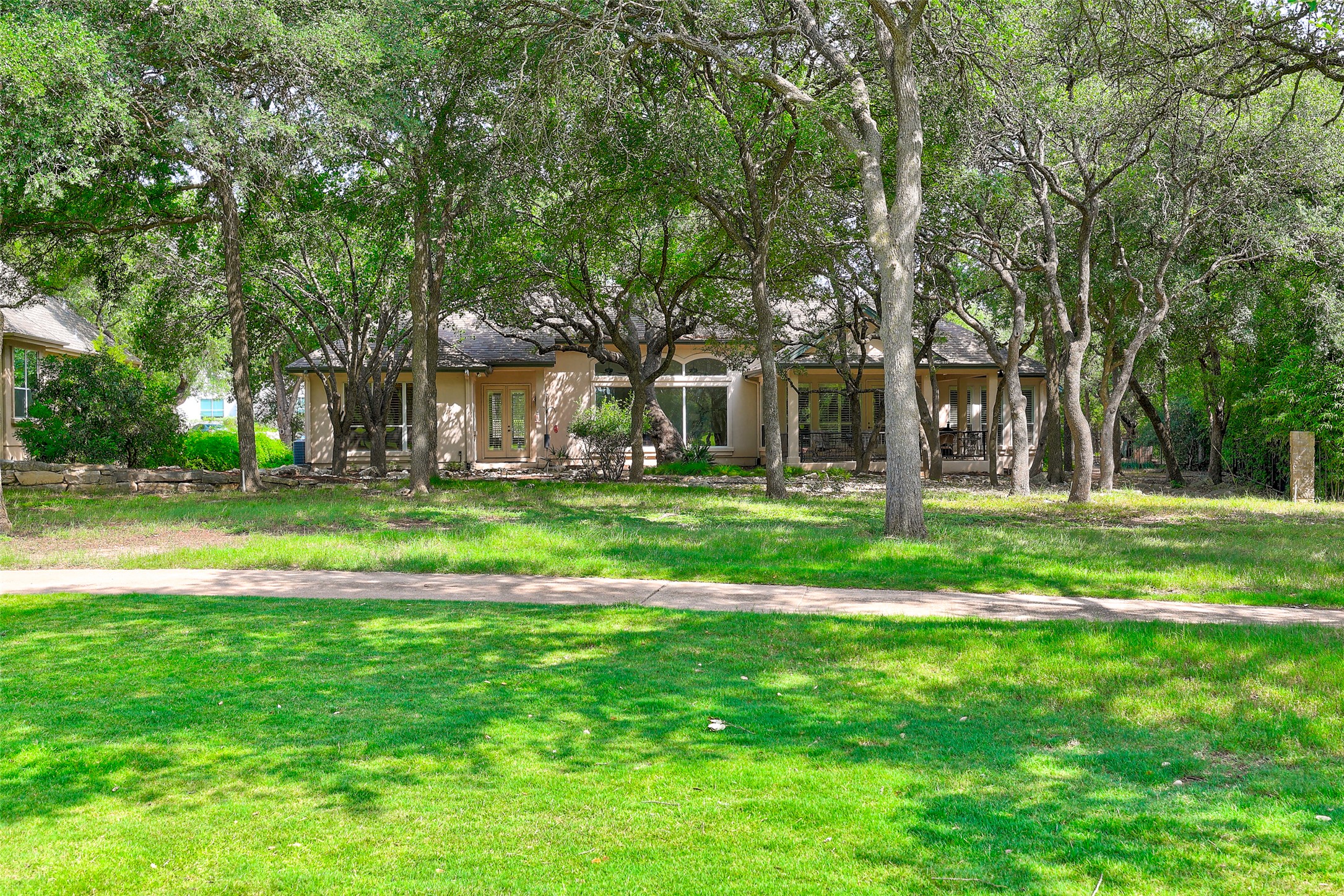 33 Meadows End Georgetown, TX 78628 - Photo 37 of 40 Mature trees frame this inviting residence, offering natural privacy and a verdant setting.