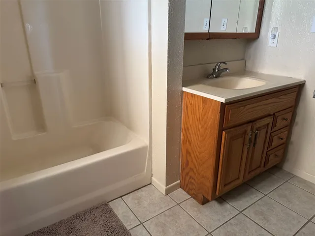 a bathroom with a sink and a bathtub