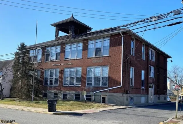 a front view of a house with swimming pool