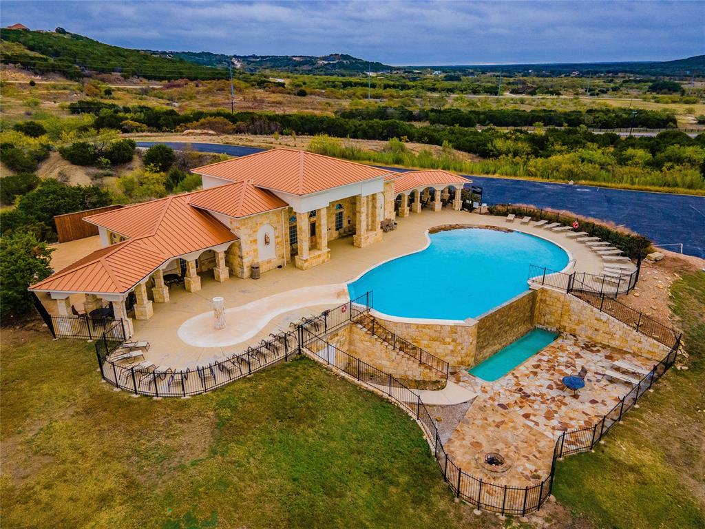 Lot 764 Sawtooth Mountain Road Graford, TX 76449 - Photo 16 of 18 an aerial view of a house with a swimming pool yard and outdoor seating