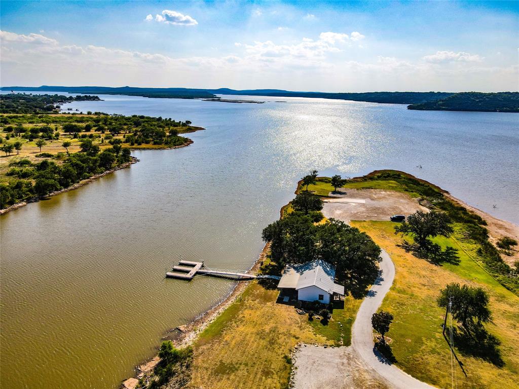 Lot 764 Sawtooth Mountain Road Graford, TX 76449 - Photo 18 of 18 an aerial view of a house with a lake view