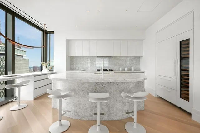 a kitchen with stainless steel appliances granite countertop a sink and a stove