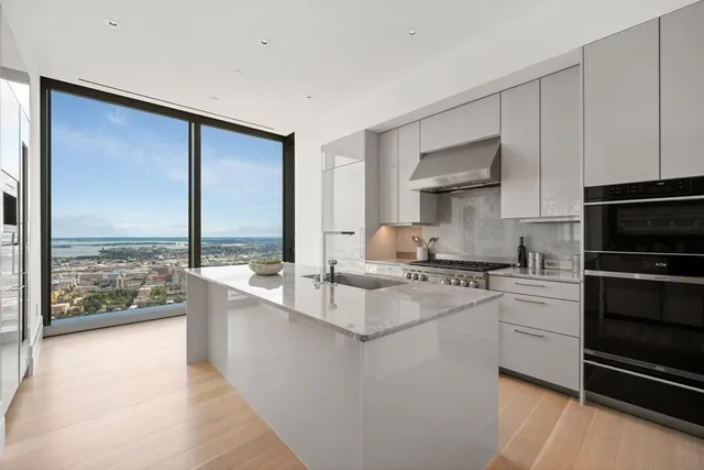 a kitchen with a stove a sink and a refrigerator