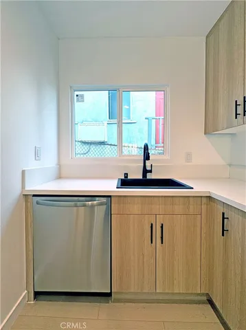 a kitchen with a sink and a window