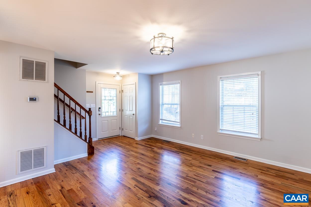 35 Zephyr Road Palmyra, VA 22963 - Photo 12 of 51 a view of an empty room with wooden floor and a window