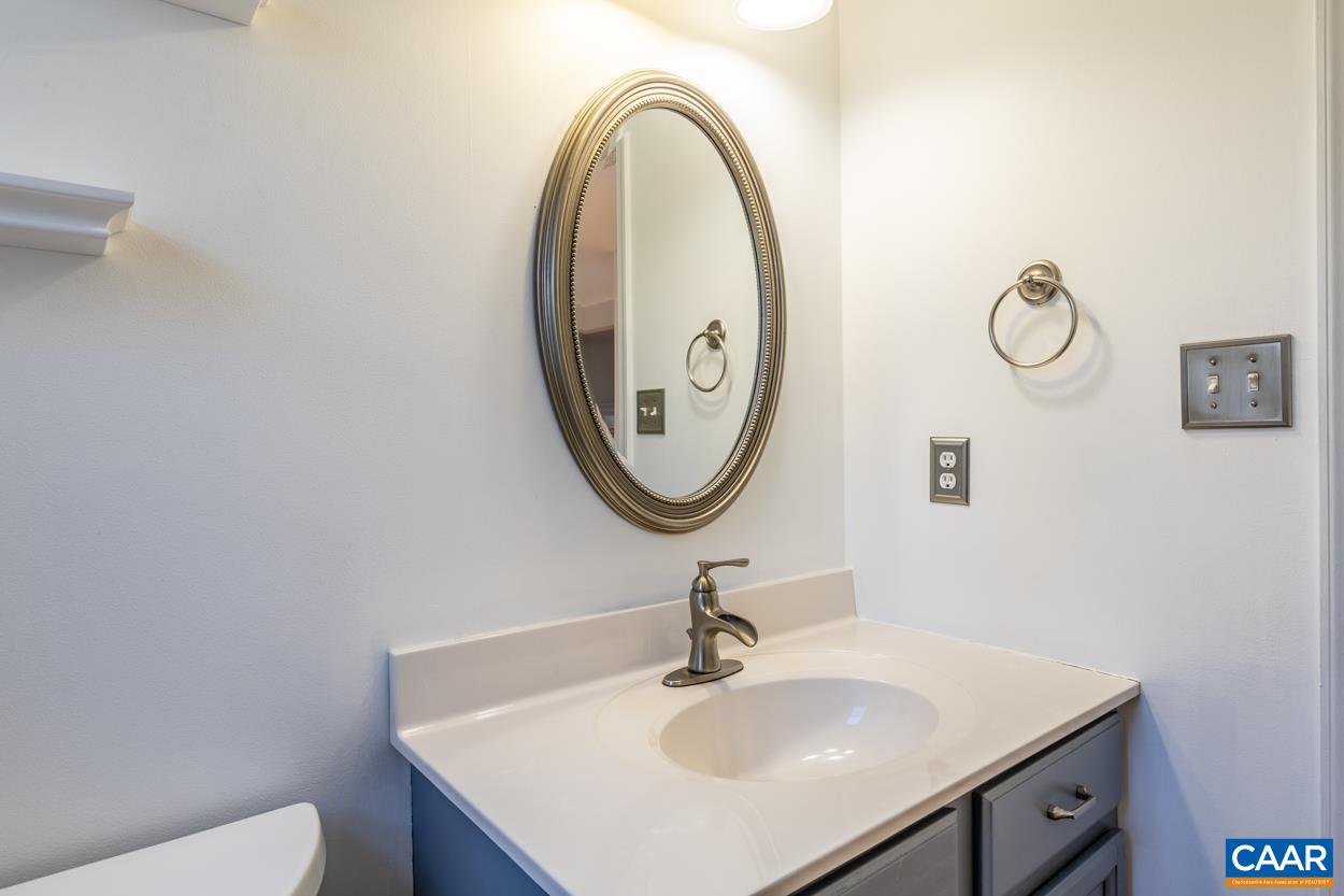 35 Zephyr Road Palmyra, VA 22963 - Photo 18 of 51 a bathroom with a toilet a sink and a mirror
