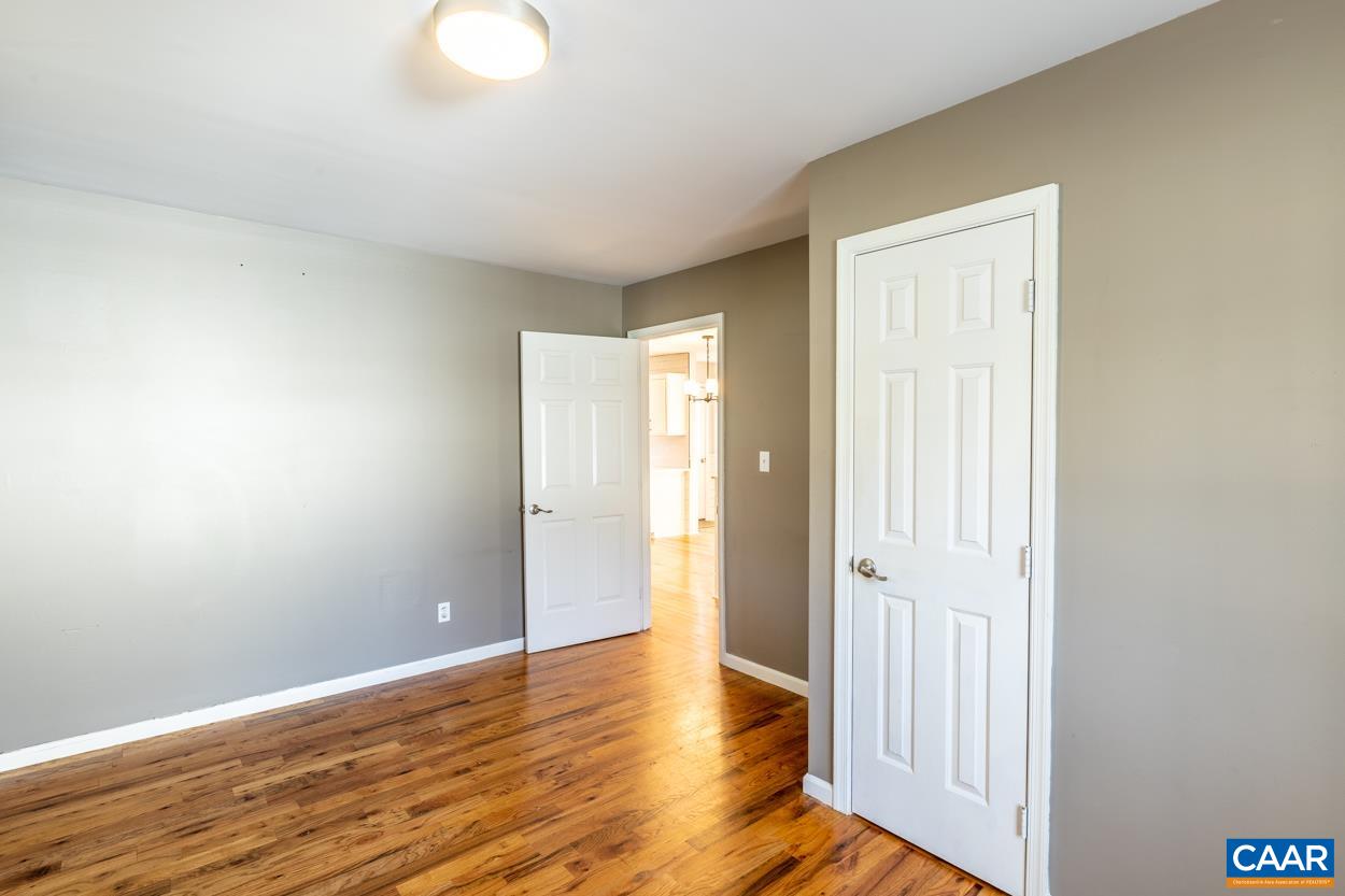 35 Zephyr Road Palmyra, VA 22963 - Photo 21 of 51 a view of an empty room with wooden floor and a window