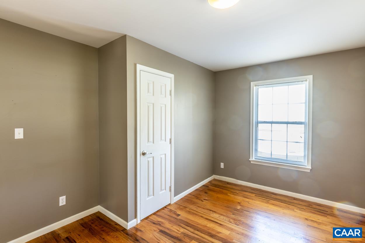 35 Zephyr Road Palmyra, VA 22963 - Photo 22 of 51 a view of an empty room with wooden floor and a window