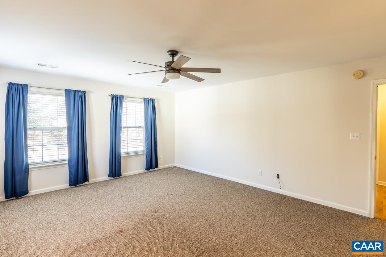 35 Zephyr Road Palmyra, VA 22963 - Photo 26 of 51 a view of a big room with windows and chandelier fan