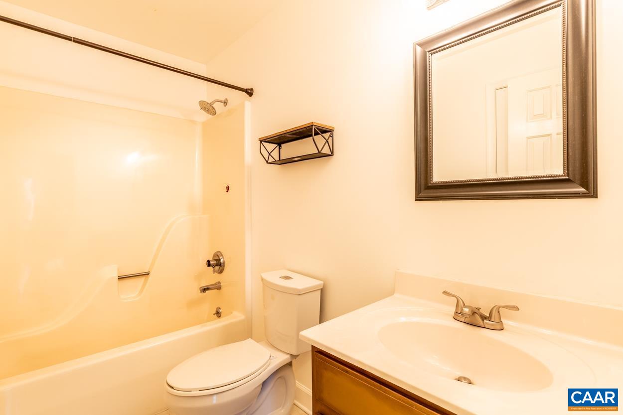 35 Zephyr Road Palmyra, VA 22963 - Photo 32 of 51 a bathroom with a sink a toilet and shower