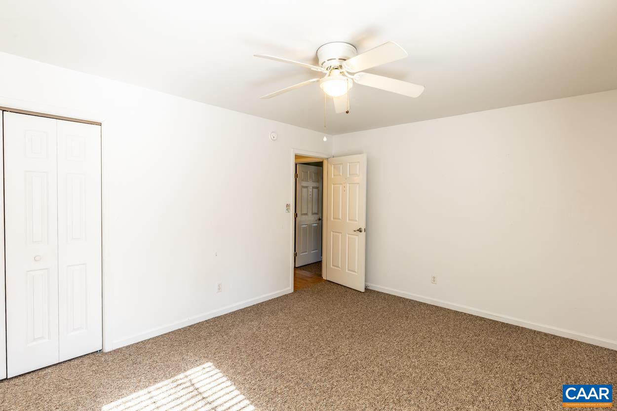 35 Zephyr Road Palmyra, VA 22963 - Photo 35 of 51 an empty room with a ceiling fan and a window