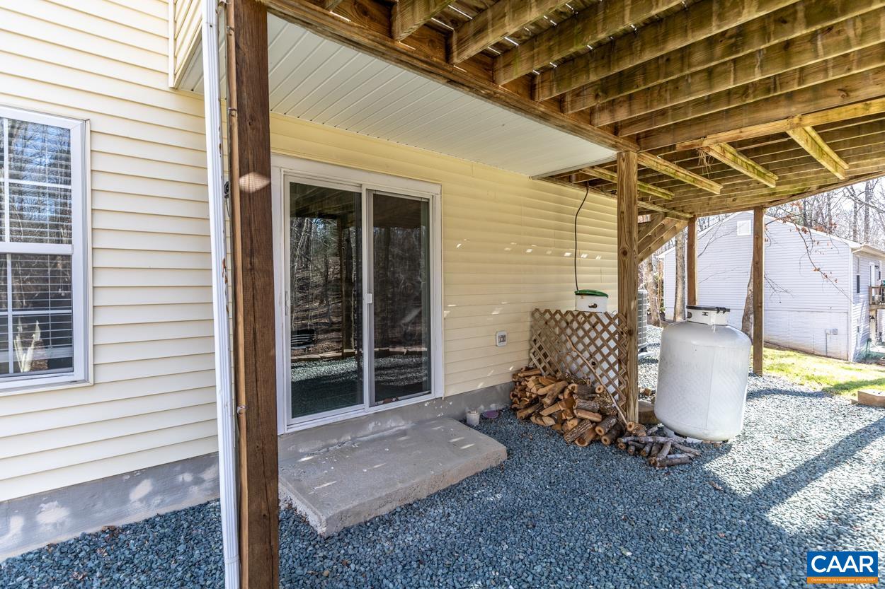 35 Zephyr Road Palmyra, VA 22963 - Photo 48 of 51 a view of a backyard with table and chairs and wooden floor