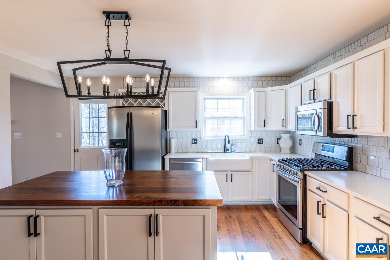 35 Zephyr Road Palmyra, VA 22963 - Photo 10 of 51 a kitchen with stainless steel appliances granite countertop a sink counter space and cabinets