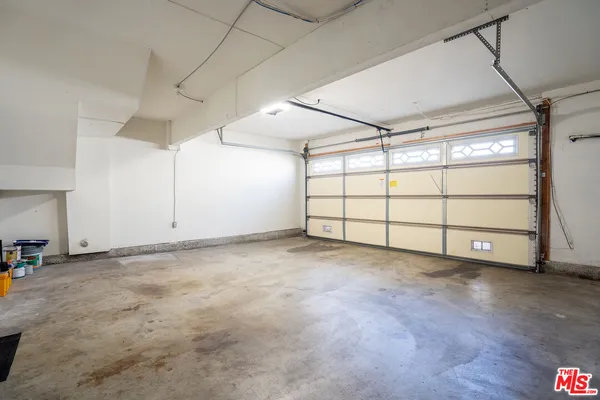 a view of a house with swimming pool and sitting area
