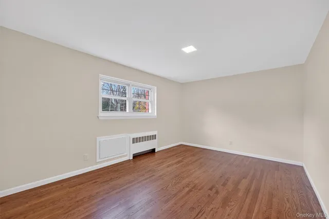 a kitchen with granite countertop a sink stove and cabinets
