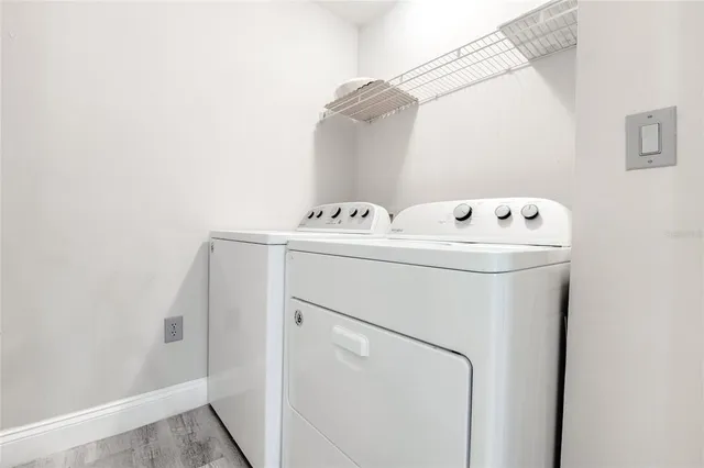 a utility room with dryer and washer