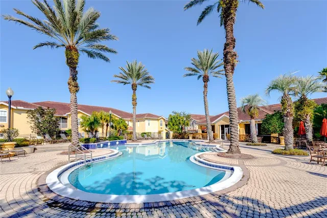 a view of a swimming pool with a table and chairs