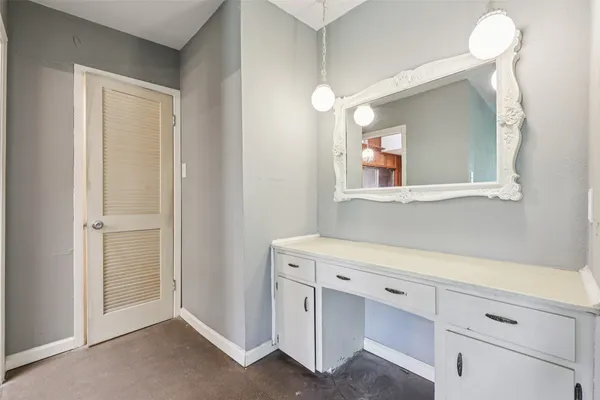 a room with cabinets and a wooden floor
