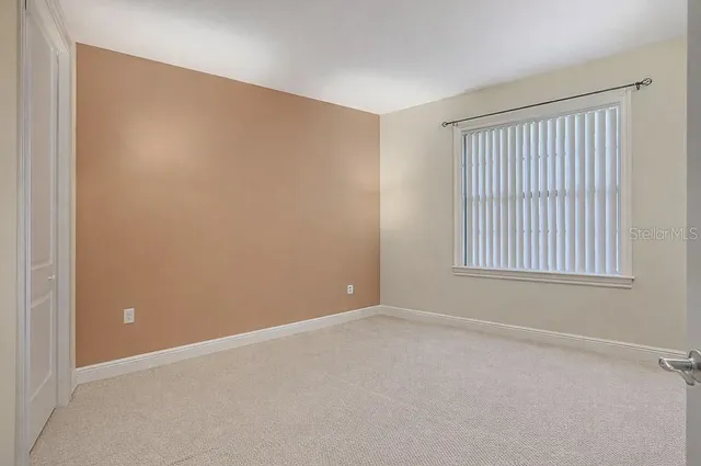 a bathroom with a sink a toilet and a shower curtain