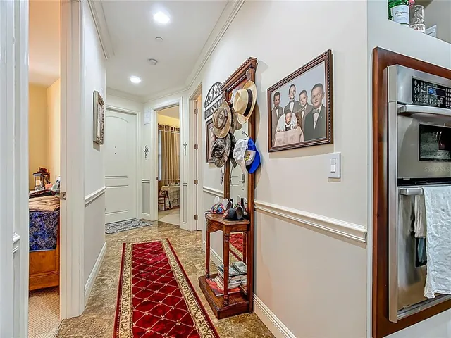 a kitchen with granite countertop wooden cabinets stainless steel appliances and a granite counter top