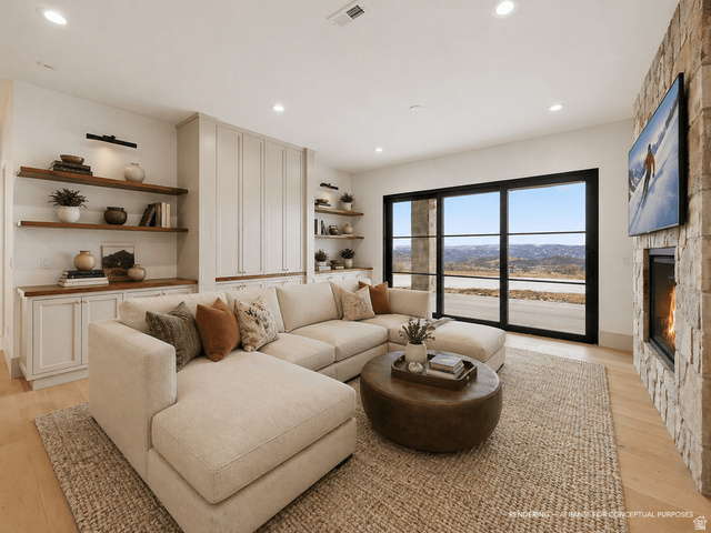 2155 East Wrangler Road Kamas, UT 84036 - Photo 10 of 62 Living room with light wood-style floors, a fireplace, and recessed lighting