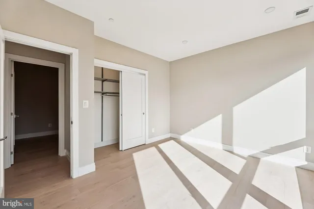 a view of staircase with white walls