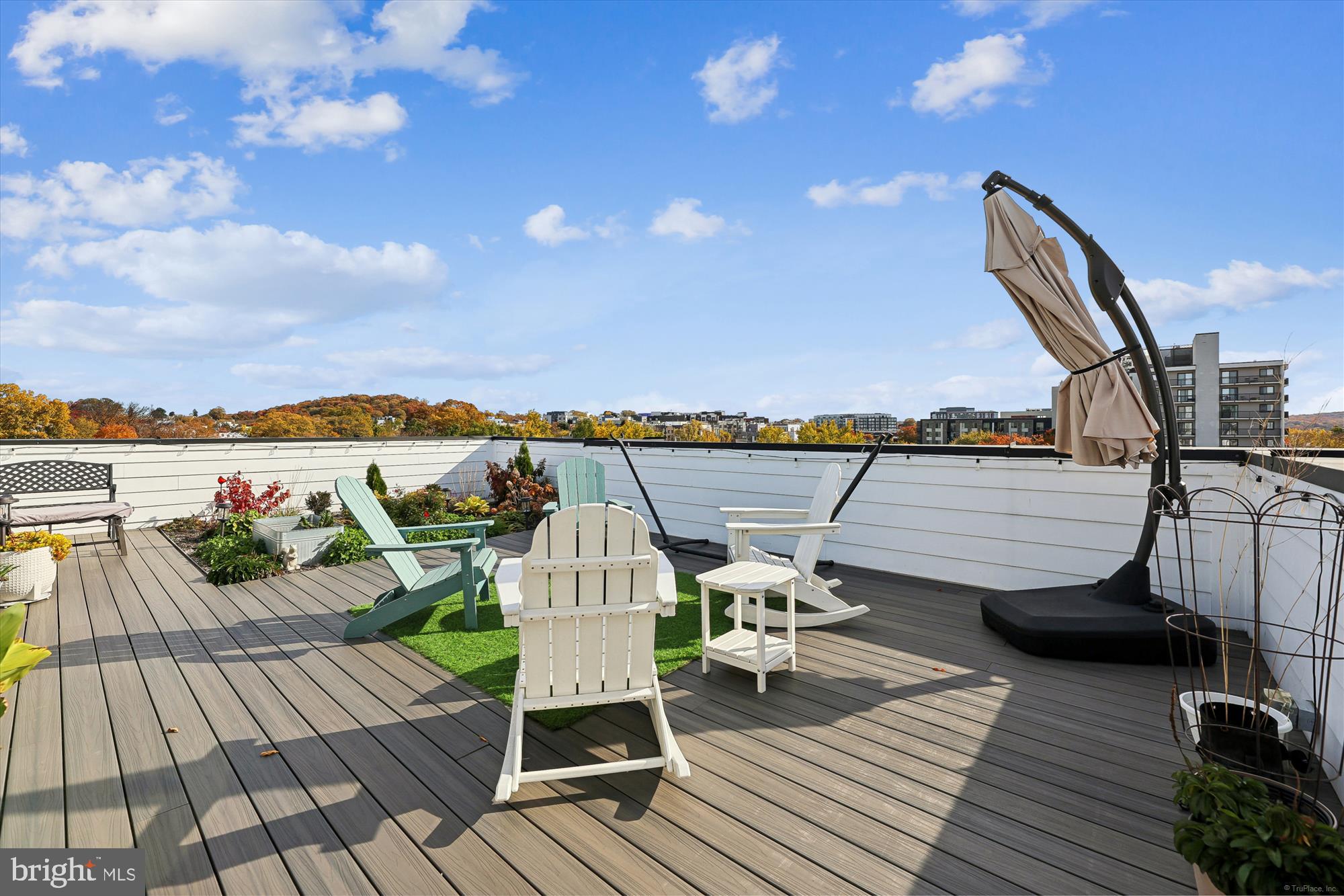 1102 Staples Street Northeast, Unit 301 Washington, DC 20002 - Photo 17 of 24 a view of a balcony with lounge chair and wooden floor