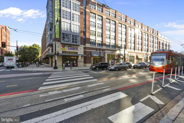 a view of a lake with lawn chairs