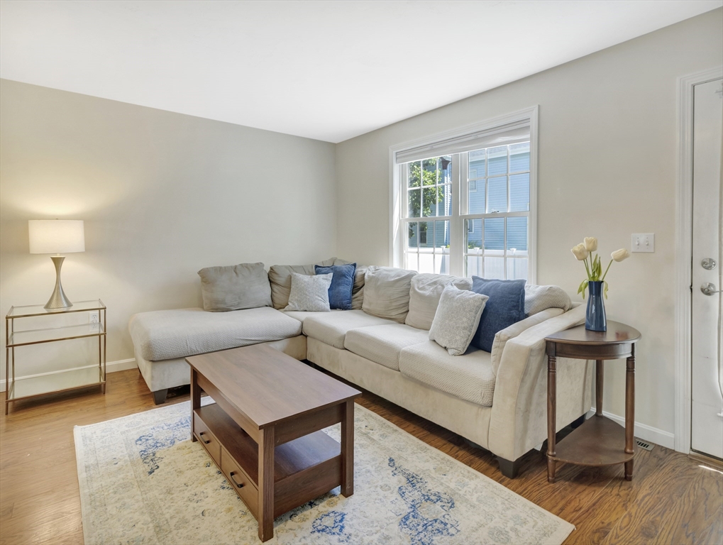 13 Shawmut Avenue, Unit 13 Mansfield, MA 02048 - Photo 6 of 34 a living room with furniture and wooden floor