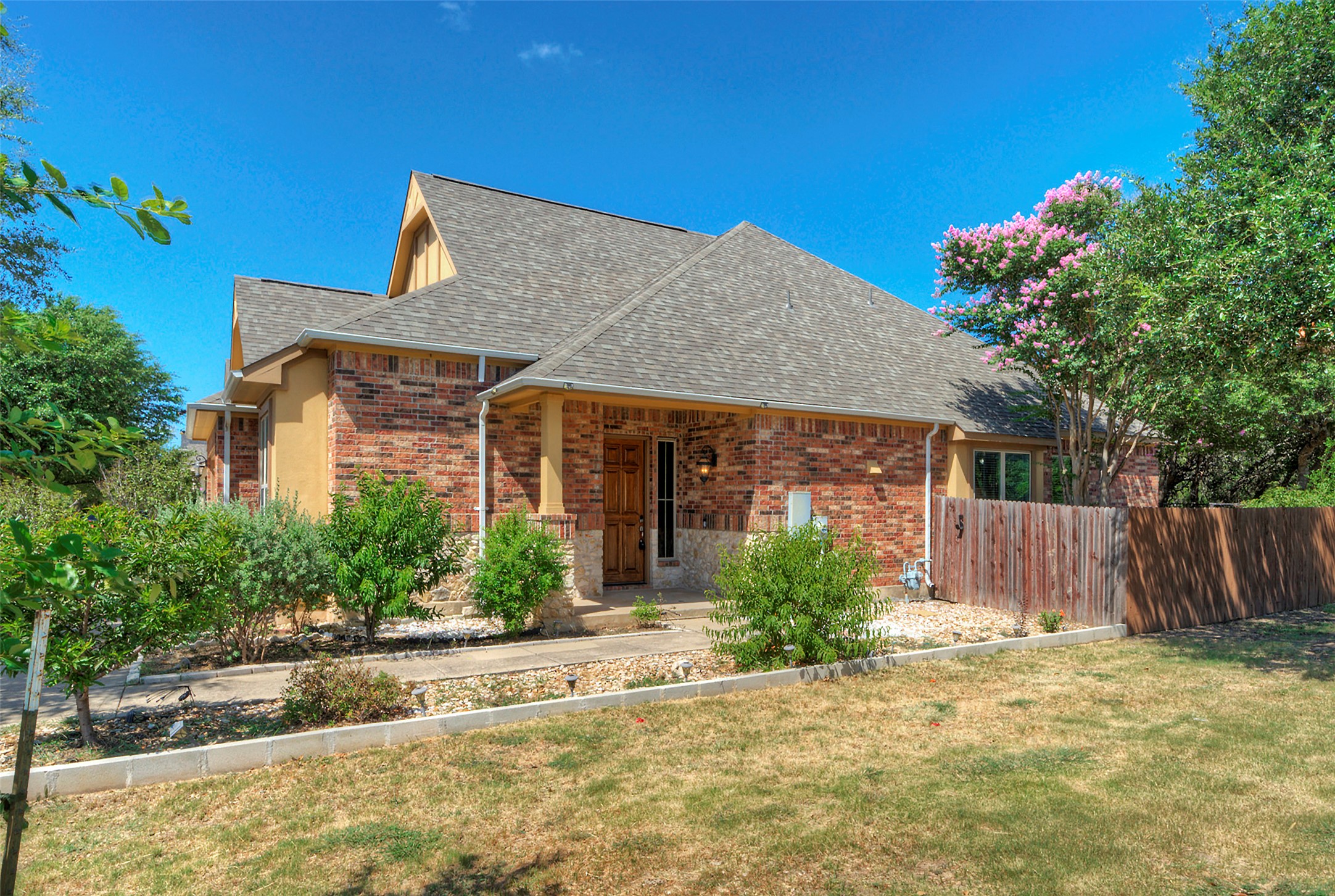1601 Nelson Ranch Loop Cedar Park, TX 78613 - Photo 4 of 30 An inviting stone and brick facade sits under a classic shingled roofline.