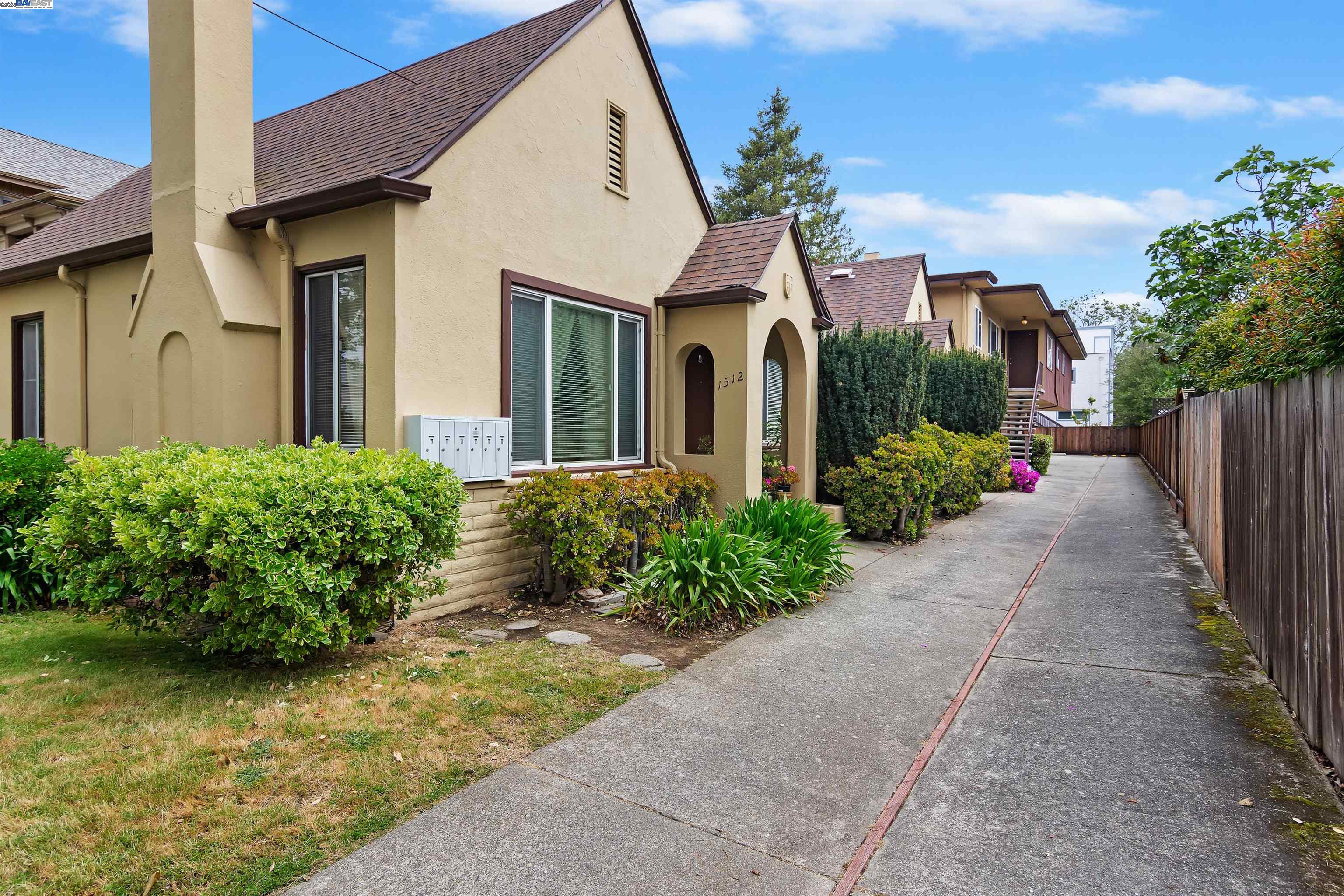 a front view of a house with garden