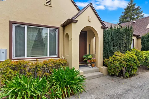 a view of a front of house with potted plants