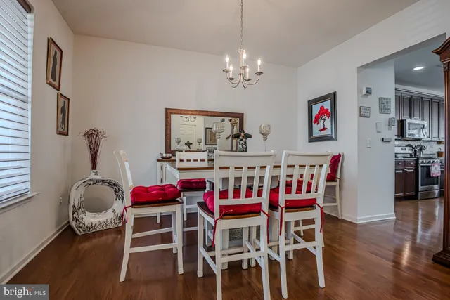 a kitchen with granite countertop a sink stainless steel appliances and cabinets
