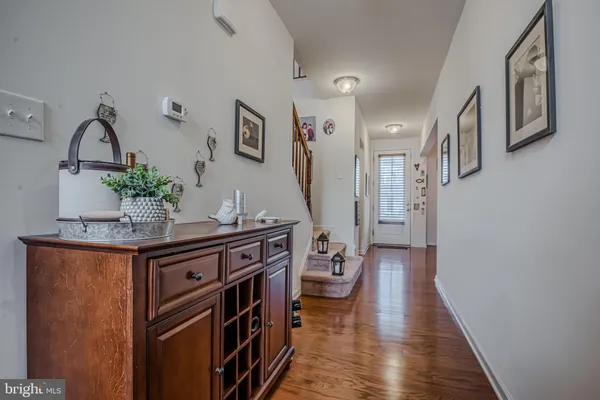 a kitchen with granite countertop a sink stainless steel appliances and cabinets