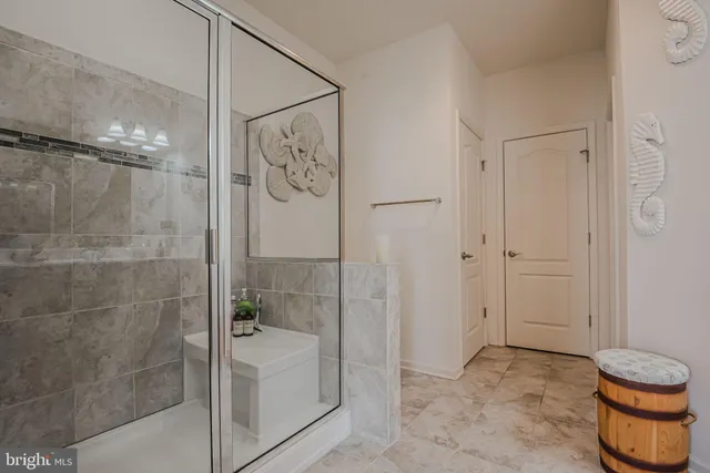 a bathroom with a toilet and a shower curtain