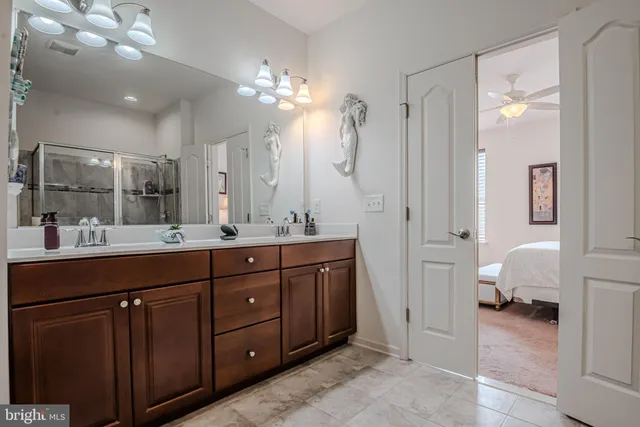 a living room with furniture a rug and a flat screen tv