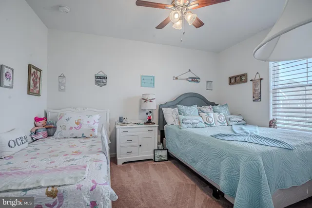 a green field with some trees in the background