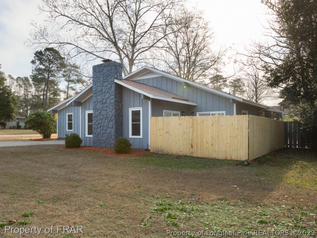 1007 Landau Road Fayetteville, NC 28311 - Photo 2 of 34 a view of a house with a yard and garage