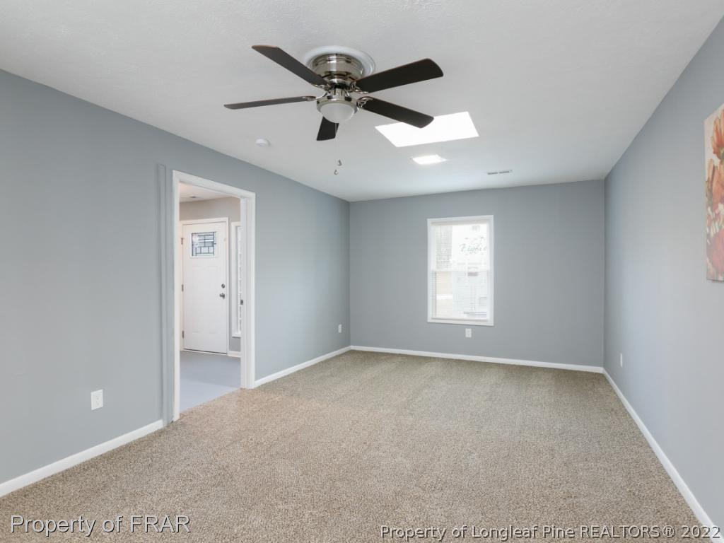 1007 Landau Road Fayetteville, NC 28311 - Photo 7 of 34 a view of an empty room with a window