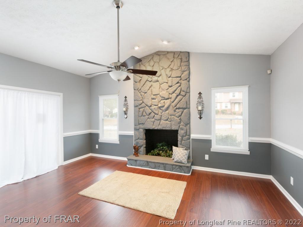 1007 Landau Road Fayetteville, NC 28311 - Photo 9 of 34 a living room with furniture and a fireplace